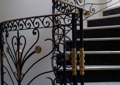 A powder coated railing with an intricate design and brass claddings to complete the look in Hampstead