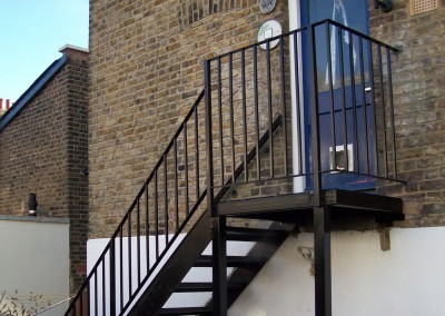 This fire escape is for the back of a commercial property.